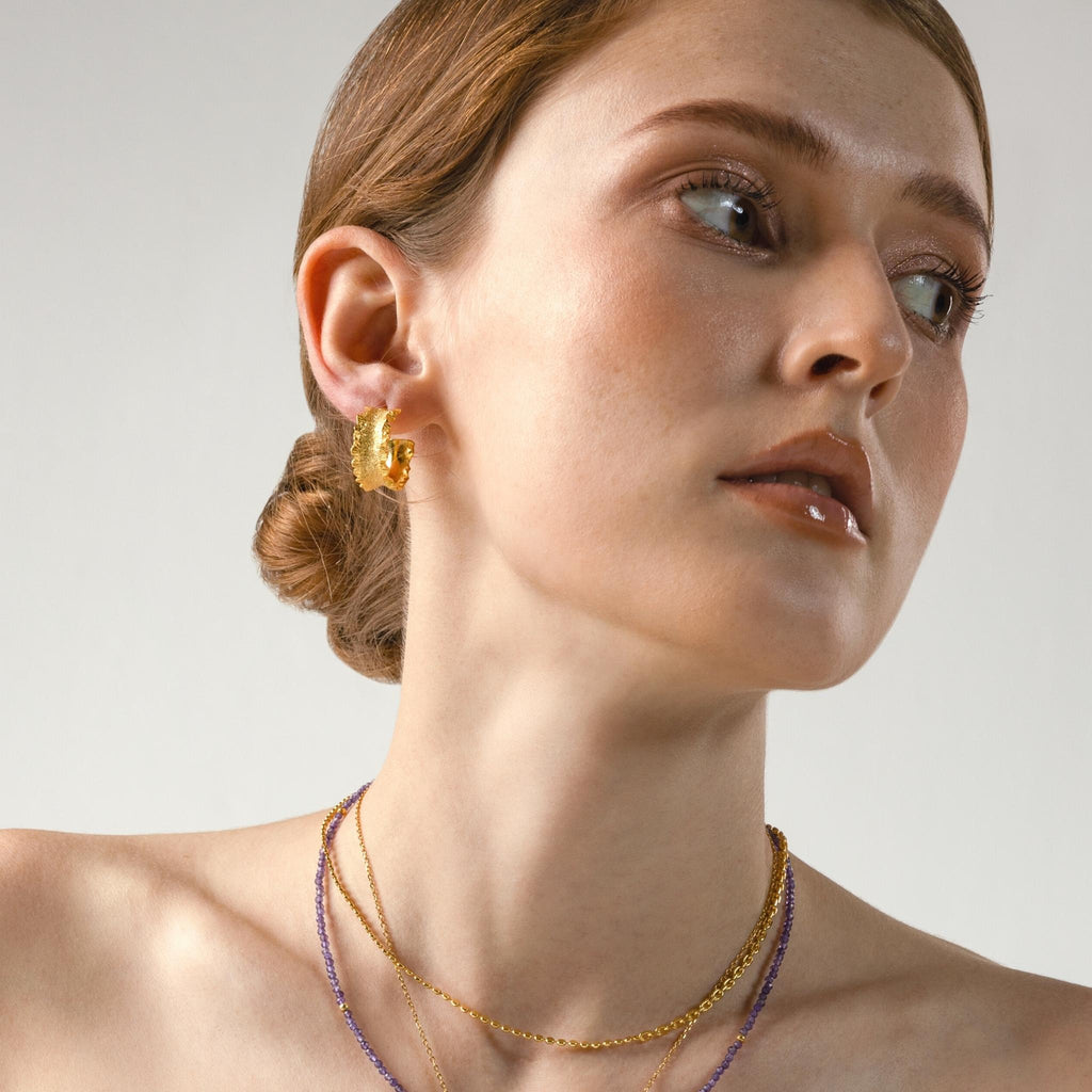 Gold Matte Hammered Texture Hoop Earrings on her