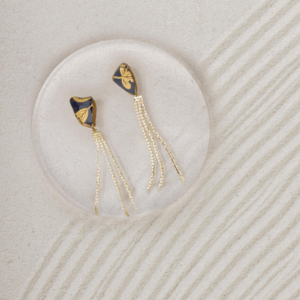 Imari Ware Porcelain Kintsugi With Golden Swing Earrings on sand