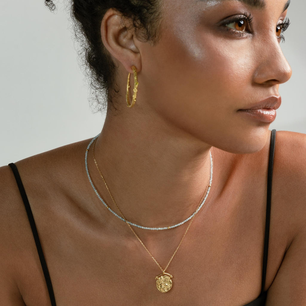 a photo of a model wears Ancient Hammered Coin Necklace from beyond bling jewellery