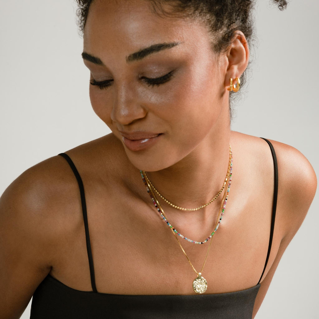 a photo of a model wears Minimalist Cross Mix Chain Choker Necklace from beyond bling jewellery