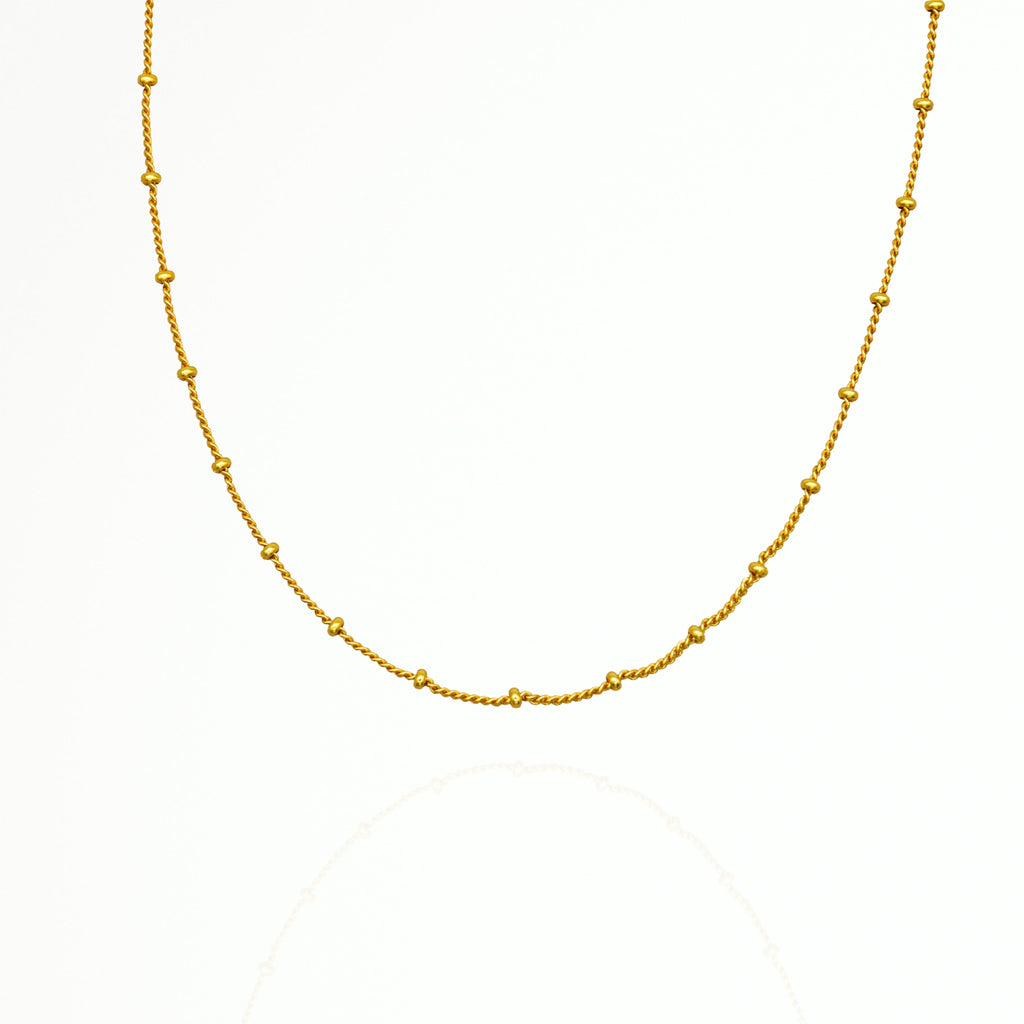 a photo of Minimalist Gold Beads Choker Necklace from Beyond Bling Jewellery