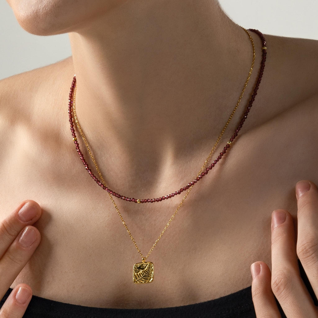 a photo of model wears Almandine Garnet Gemstones Beaded Necklace from beyond bling jewellery website