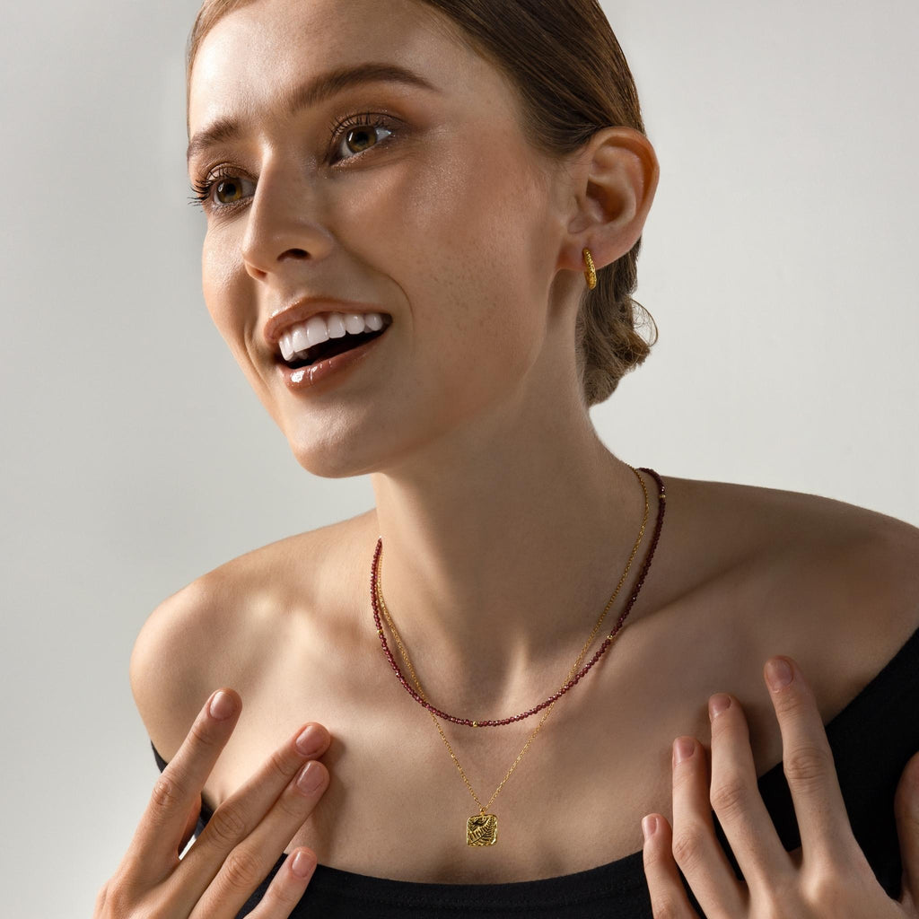 a photo of model wears Almandine Garnet Gemstones Beaded Necklace from beyond bling jewellery website