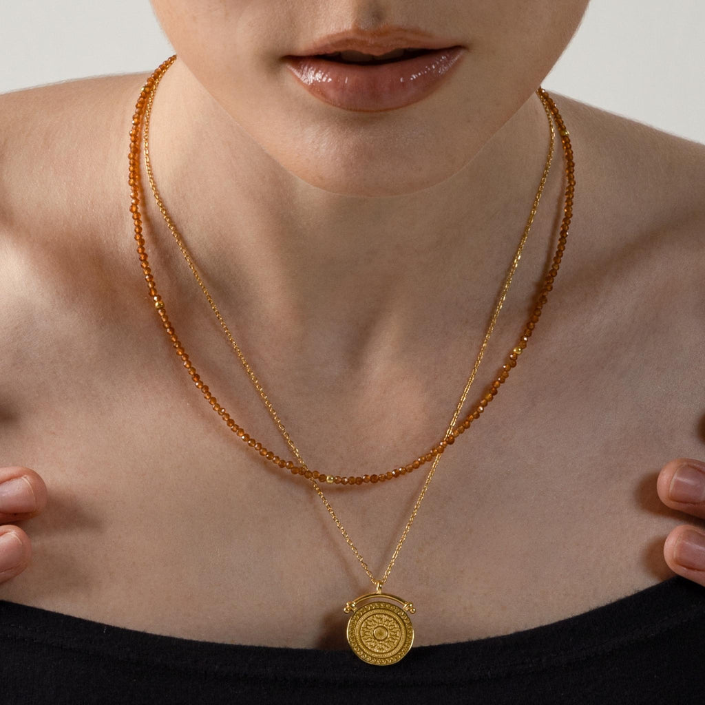 a photo of a model wears Ancient Greek Round Pendant Necklace from Beyond Bling Jewellery