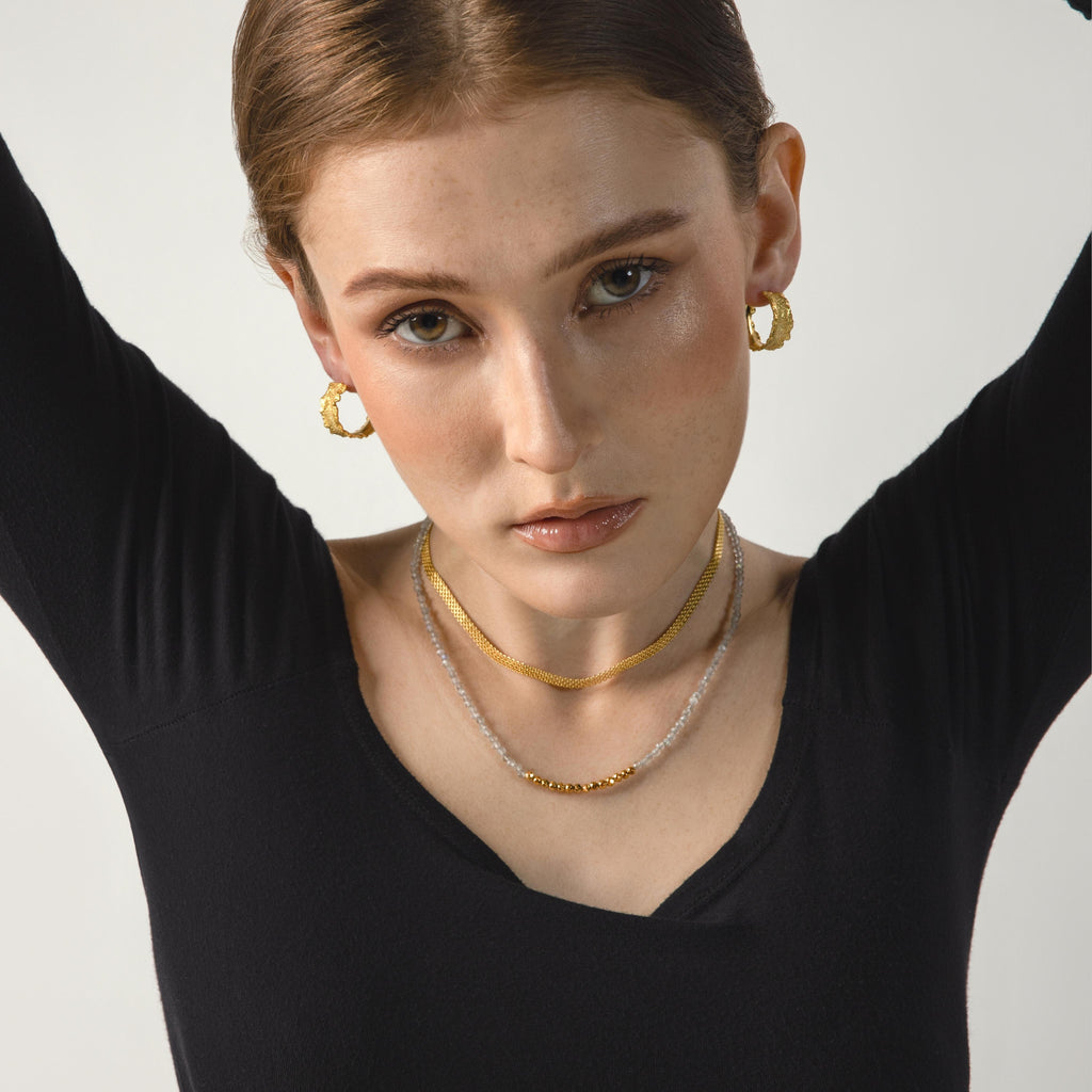 a photo of a model wears Natural Labradorite Gemstones Beaded Necklace from beyond bling jewellery website